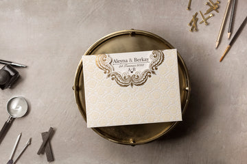 Cream Embossed Wedding Invitation with Gold Scroll Accent