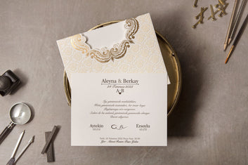 Cream Embossed Wedding Invitation with Gold Scroll Accent