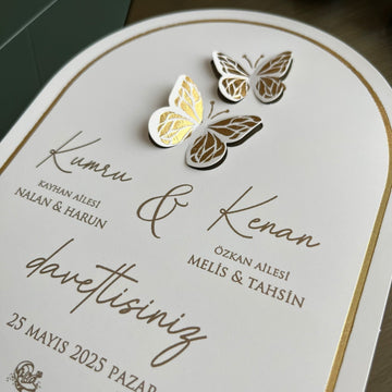 Elegant wedding invitation with gold butterfly accents and modern calligraphy details