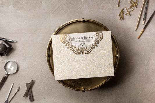 Cream Embossed Wedding Invitation with Gold Scroll Accent
