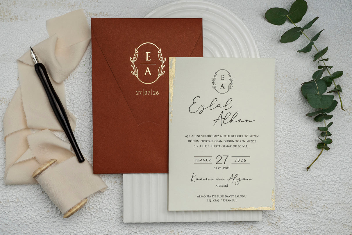 Rust-Colored Wedding Invitation with Gold Crest and Foil Edge